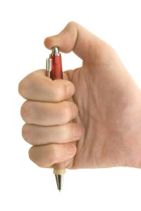 Hand clicking a pen