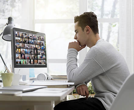 College student using computer with Zoom