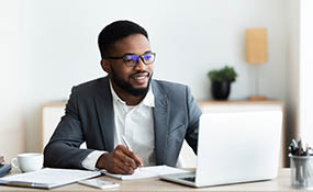 Black male working at computer