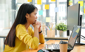 Asian female working at computer